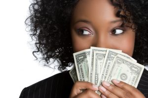 African american woman holding money